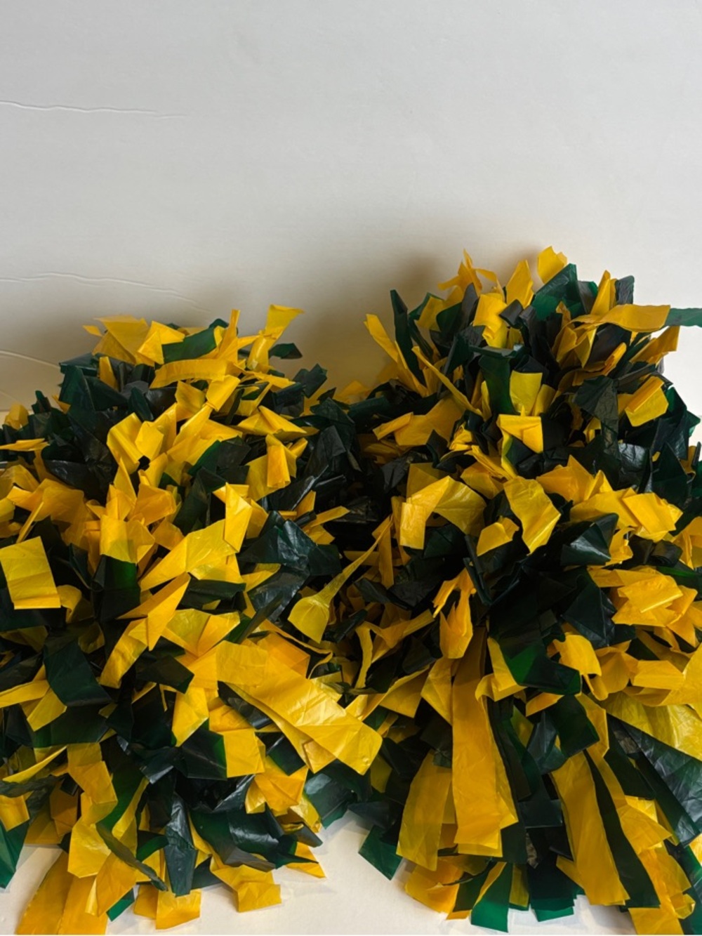 Pair of Green & Yellow Cheerleading Pom Poms - Baton Handle